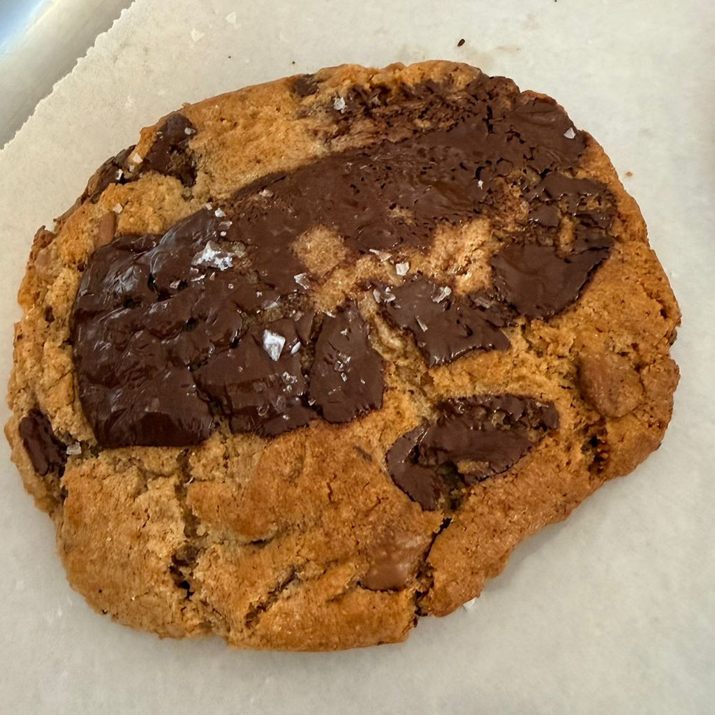 Chocolate chip cookie on a baking sheet